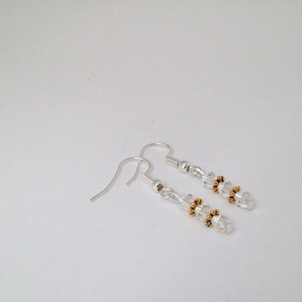 Boucles d'oreilles toupies transparentes et or