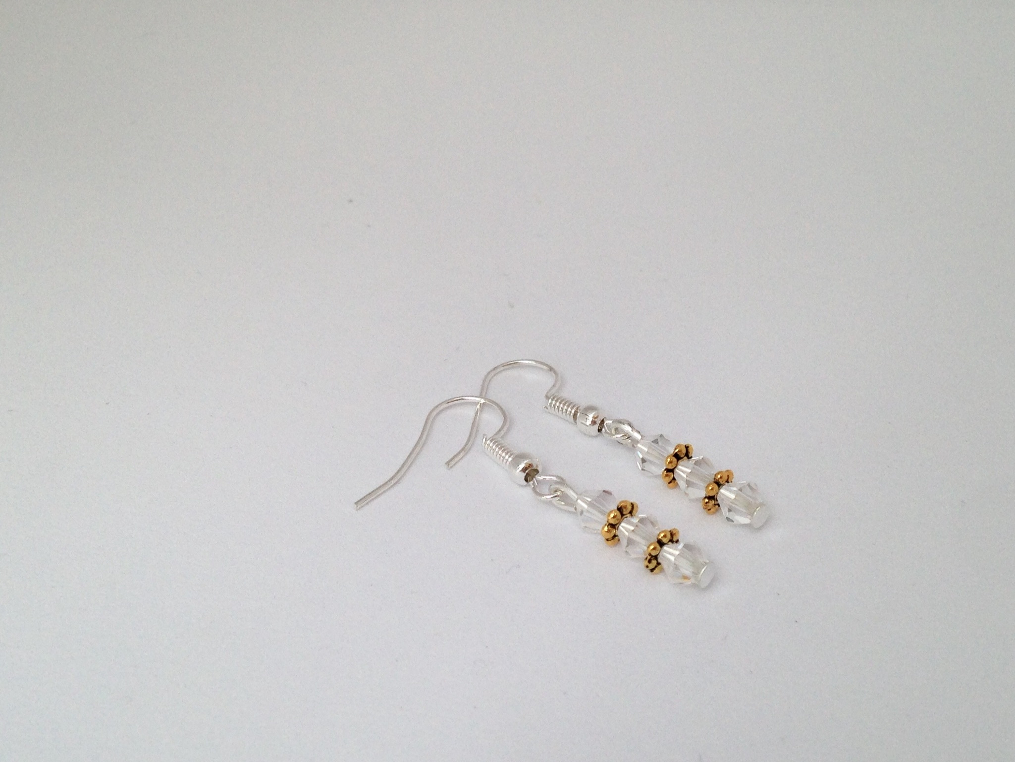 Boucles d'oreilles toupies transparentes et or